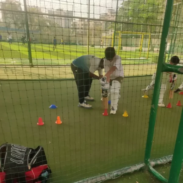 boy in cricket net